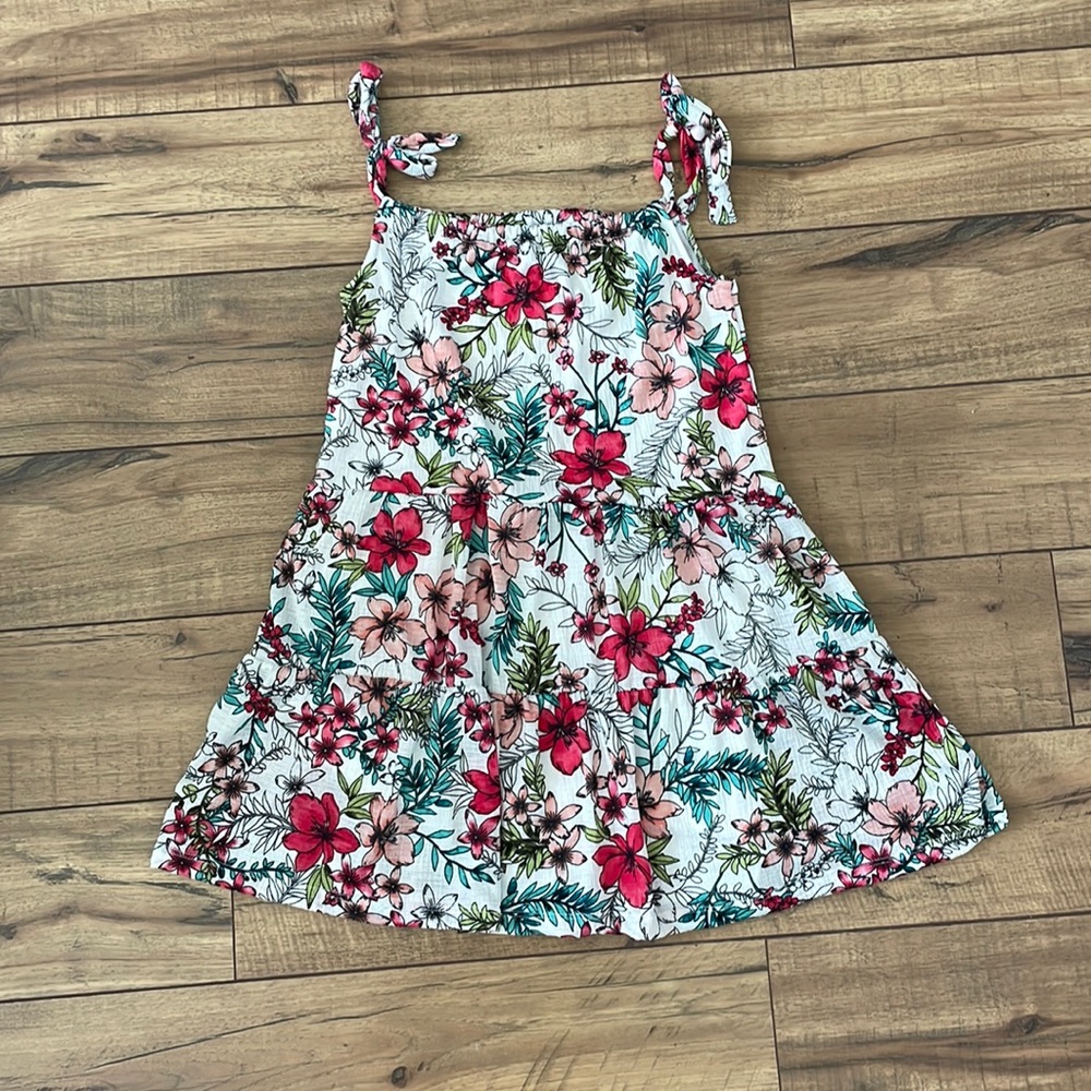 A girls beautiful floral sundress! It is brand new and never worn!